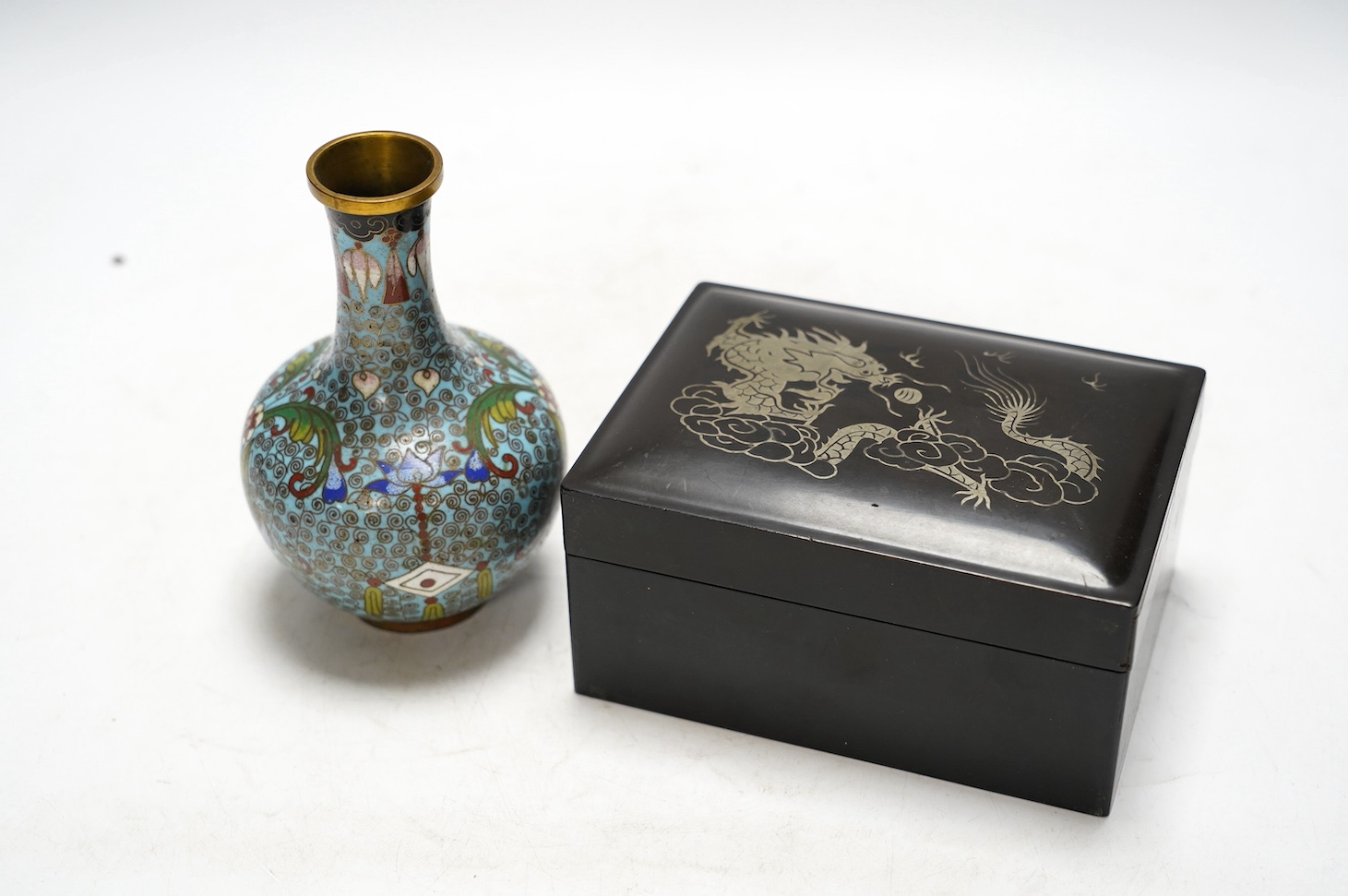 A Chinese cloisonné enamel vase, 13cm, and a set of five graduated lacquer boxes, the lids with inlaid silver decorations, largest 13.5 x 10 x 6.5cm. Condition - good